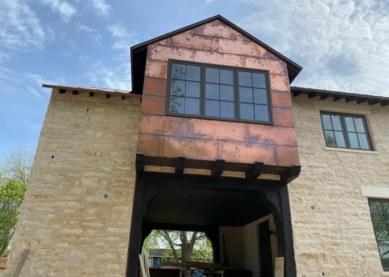 Copper metal panel facade on a stone building for Metal Roof Coating in Flossmoor
